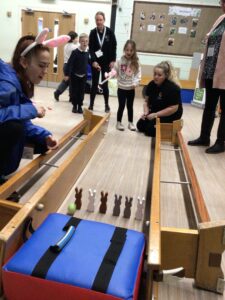 Chorley SSP have set up a Bunny Bowling Alley and a pupil is all smiles as they try their luck.